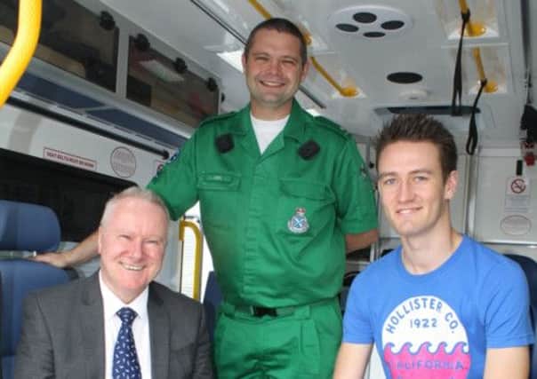 Cabinet Secretary Alex Neil, Paramedic Joel Symonds, and cardiac patient Andrew Munro. Picture: TSPL