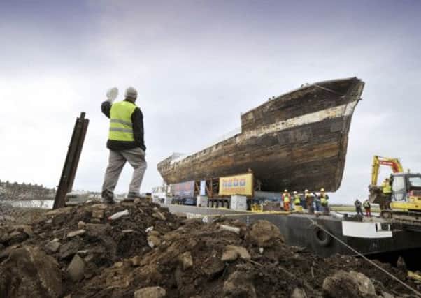The City of Adelaide being loaded onto a barge. Picture: PA