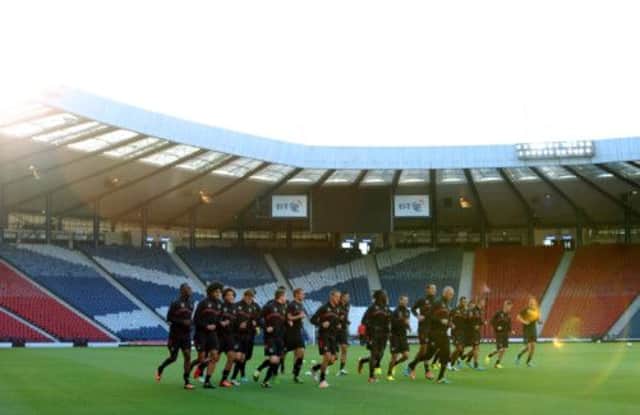 Belgium get a run out on the Hampden turf. Picture: AP