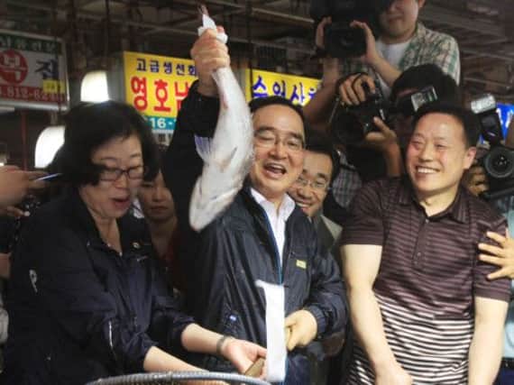 South Korea's prime minister Jung Hong-won visits a fish market in Seoul yesterday. Picture: AP