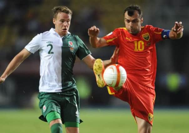 Wales' Chris Gunter and Macedonia's Goran Pandev battle for the ball. Picture: PA