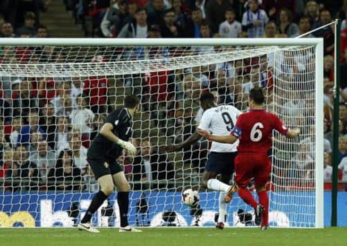 England's Danny Welbeck scores. Picture: PA
