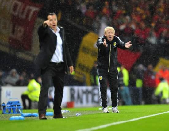 Scotland manager Gordon Strachan and his counterpart Marc Wilmots. Picture: Robert Perry