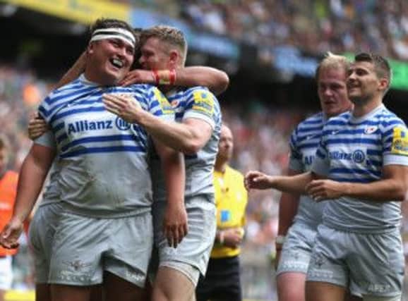 Jamie George of Saracens is mobbed by team mates after scoring his second try. Picture: Getty