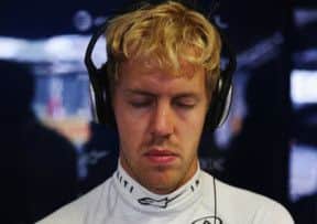 Red Bull driver Sebastian Vettel tunes out as he prepares for qualification at Monza yesterday. The meditation paid off as he took pole. Picture: Getty