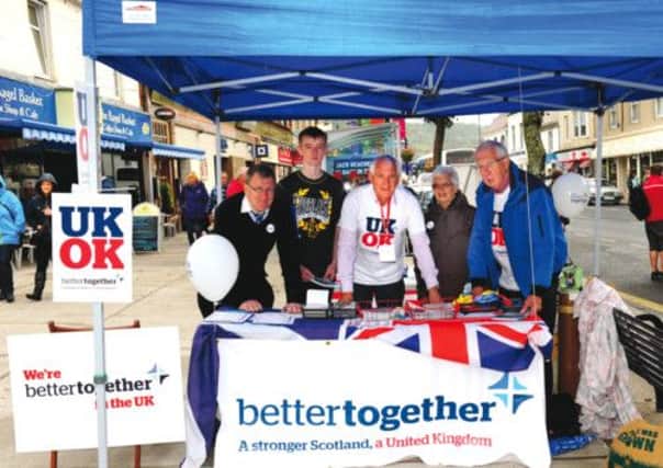 Left to right, Donald Reid, Darren Dowling, Neil Henderson, Sheila Collins and Tom Marshall fly the flag for the Better Together campaign in Largs. Picture: Robert Perry