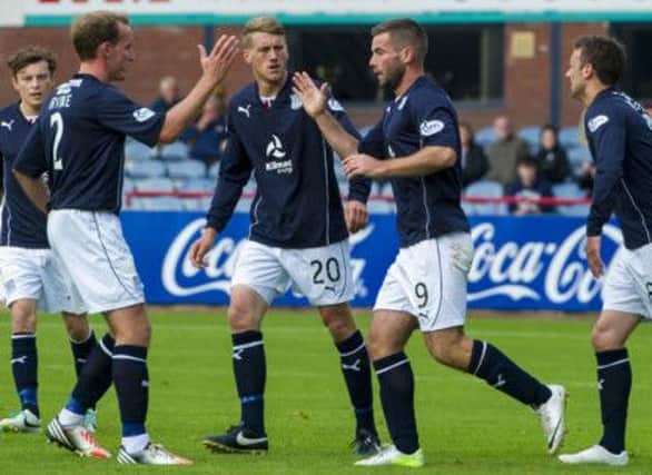 Dundee's Peter MacDonald is congratulated on his goal by his teammates. Picture: SNS
