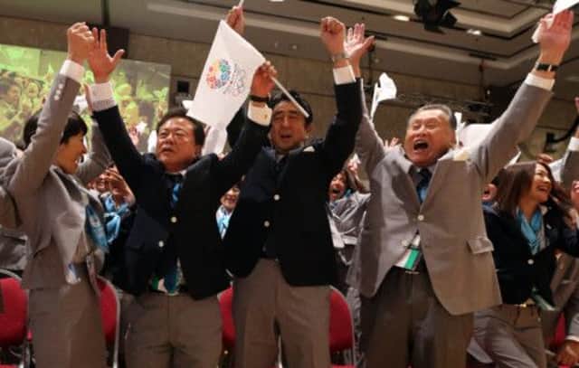 Japan's Prime Minister Shinzo Abe, Governor of Tokyo and Chairman of Tokyo 2020, Naoki Inose, second from left, and other members of the Japanese delegation celebrate the news. Picture: AP