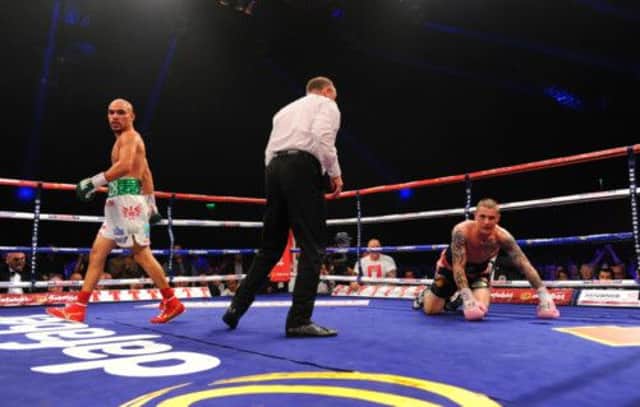 Champion Ricky Burns retained his title after the fight was drawn.  Picture: Robert Perry