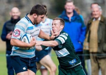 Accies' Phil Cringle fends off Hawick's Gary Johnstone. Picture: Ian Georgeson
