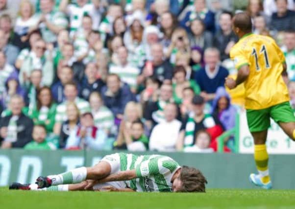 Louis Tomlinson lies on the ground after the challenge from Agbonlahor, left. Picture: SNS