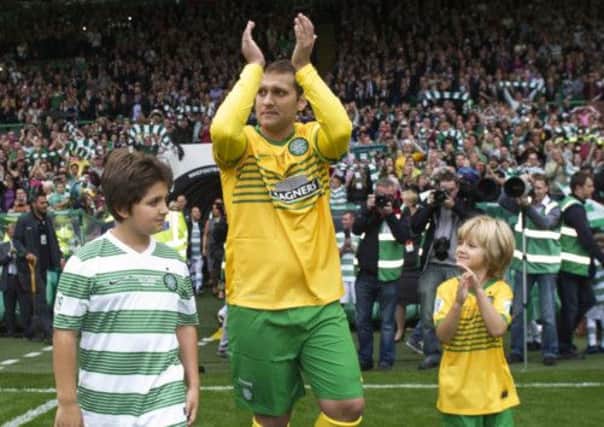 Stiliyan Petrov applauds the fans as he makes his way onto the park with his children. Picture: SNS