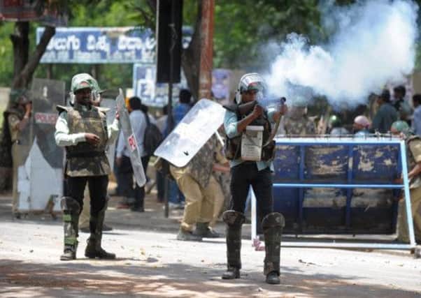 Indian police fire tear gas rounds against pro-Telangana state students protesting in Hyderabad. Picture: Getty