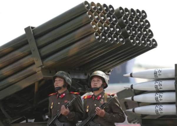 North Korean soldiers parade through Kim Il Sung Square with missiles and rockets during a mass military parade. Picture: AP
