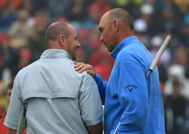 Craig Lee (left) is consoled by winner Thomas Bjorn at the end of the Omega European Masters in Crans, Switzerland. Picture: Getty