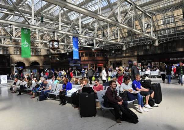 Travellers wait for an announcement in Glasgow's Central Station. Picture: Robert Perry