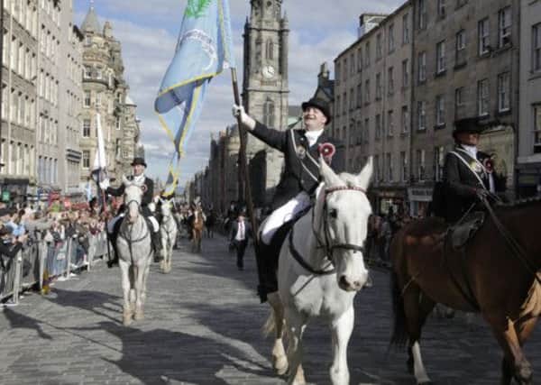 Edinburgh Captain Stewart Nicoll and Edinburgh Lass Karrie McGill lead the March. Picture: Toby Williams