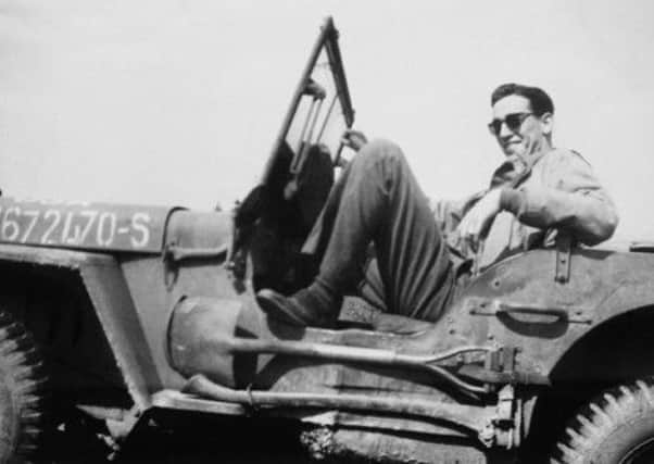 JD Salinger pictured in a US Army jeep during WWII. Picture: Comp