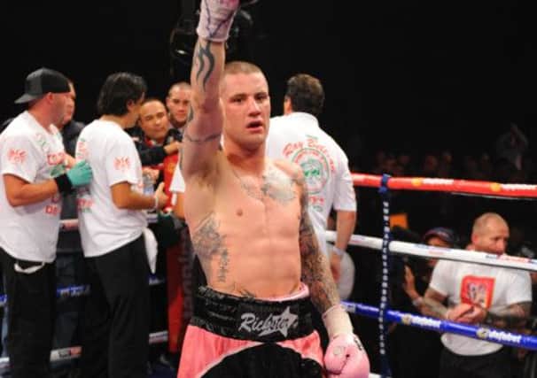 Ricky Burns returns home after surgery to mend a broken jaw. Picture: Robert Perry