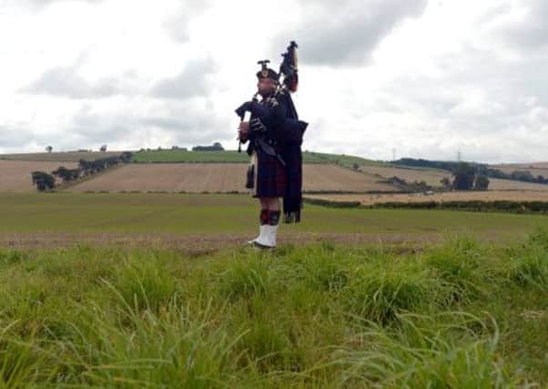 A lone piper at Flodden Field yesterday. Picture: Phil Wilkinson