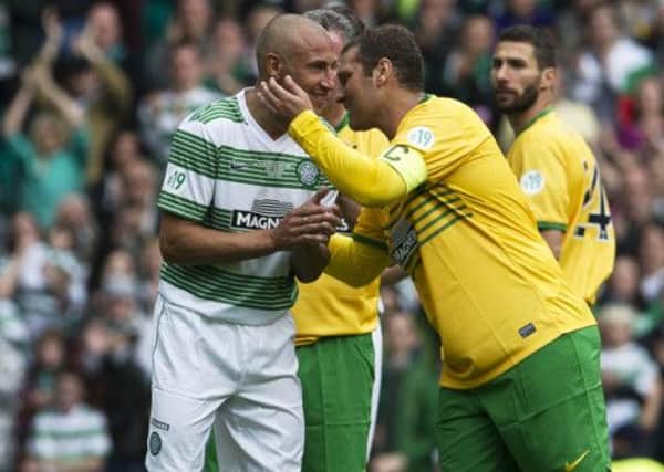 Stiliyan Petrov shakes hands with former team-mate Henrik Larsson during the weekend's charity game. Picture: SNS