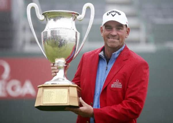 Thomas Bjorn of Denmark poses with the trophy. Picture: AP