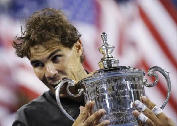 Another tasty win for Rafael Nadal as he lifts the US Open trophy after defeating Novak Djokovic. Picture: AP