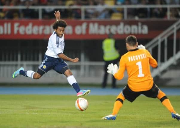 Scotland's Ikechi Anya scores the opening goal. Picture: PA