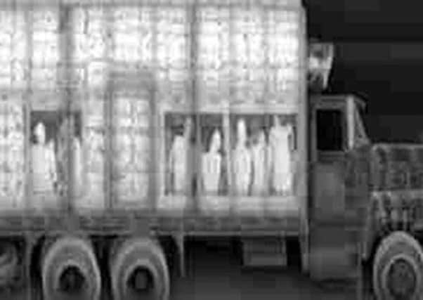 An image of people smuggling, with trafficked persons hidden inside a truck. Picture: PA