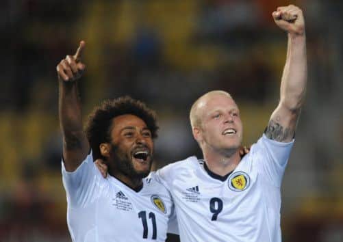 Ikechi Anya and Steven Naismith celebrate Anya's opener. Picture: PA