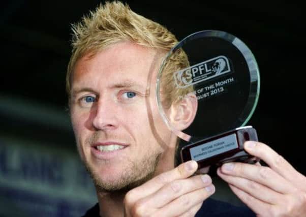 Richie Foran receives the SPFL Player of the Month award for August. Picture: SNS