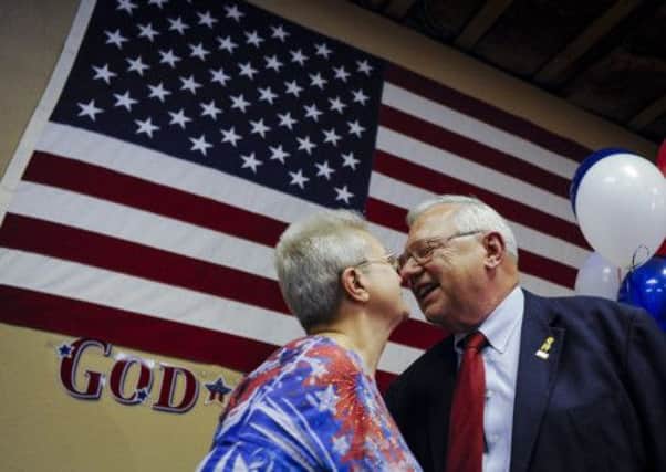Bernie Herpin kisses his wife Linda as they celebrate his victory in the election to recall Colorado State Senator John Morse. Picture: AP
