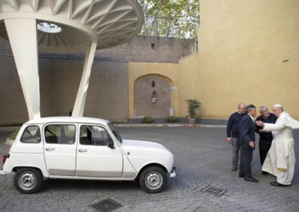 Pope Francis and his 1984 Renault 4. Picture: AP