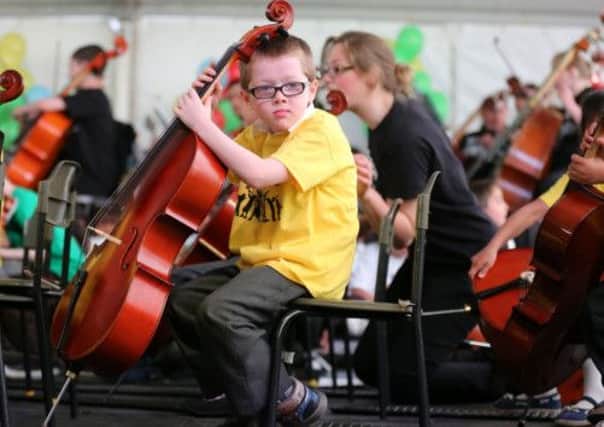 Primary school children performed at the Big Noise Orchestra community concert in Govan, Glasgow during the summer. Picture: PA