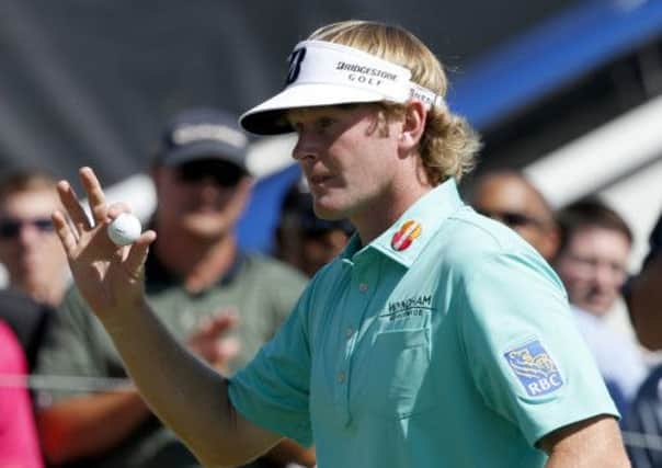 Brandt Snedeker acknowledges the crowd after the first of his six consecutive birdies. Picture: AP