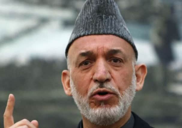 Hamid Karzai has a win to celebrate on the football front. Picture: Reuters