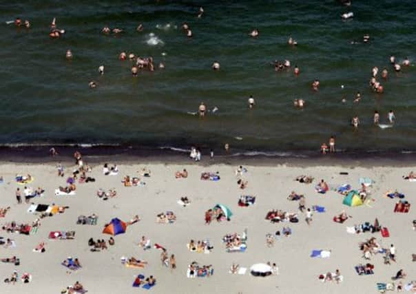 Beachgoers on Travemuende on the Baltic Sea, northern Germany. Chemical weapons used in wartime conflict pose a severe threat to the Baltic System, new research has claimed. Picture: AP