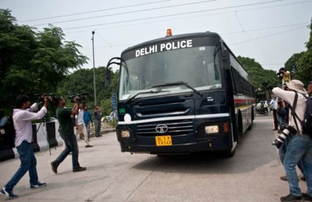 An Indian police van believed to be carrying the accused arrives at the Saket Court Complex in New Delhi today. Picture: AFP