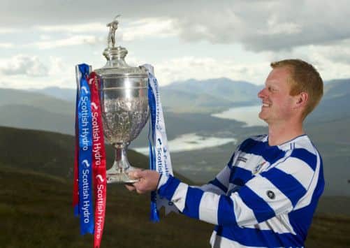 Jamie Robinson of Newtonmore took to the Nevis Range to promote this year's final. Picture: Johnston Press