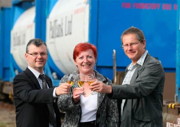Tony Jarvis of HIE, Moray Councillor Fiona Murdoch and Frank Roach of Hitrans launch the whisky train trial. Picture: Peter Jolly/HIE