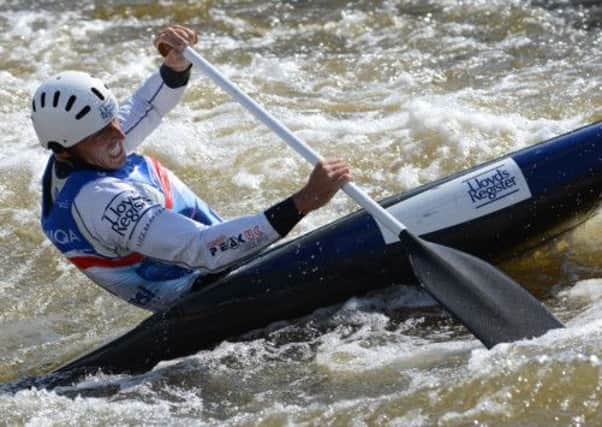 Crest of a wave: David Florence on his way to victory at the canoe slalom world championships in Prague yesterday. Photograph: Getty