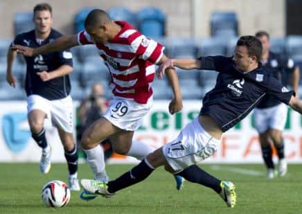 The Enforcer: Dundees Kyle Benedictus, right, challenges Mickael Antoine-Curier during yesterdays draw. Photograph: Garry Williamson