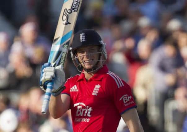 England's Jos Buttler raises his bat as he reaches 50 during his innings of 75. Picture: AP