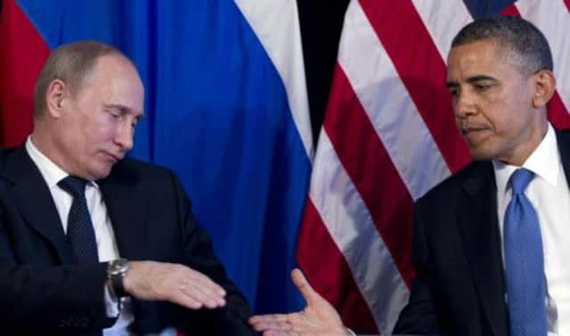 Upper hand: Vladimir Putin and Barack Obama. Picture: AP