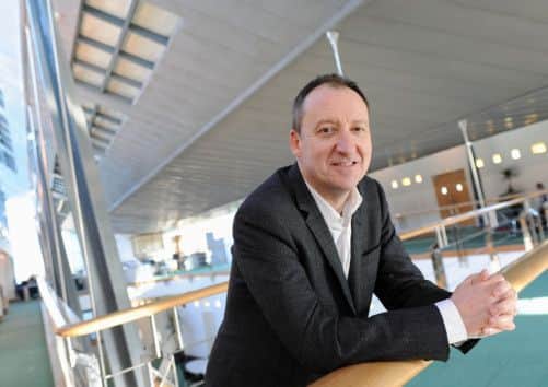 John Innes, former musician and now an ebullient dealmaker who led the sale of Amor Group to Lockheed Martin. Picture: Victoria Stewart