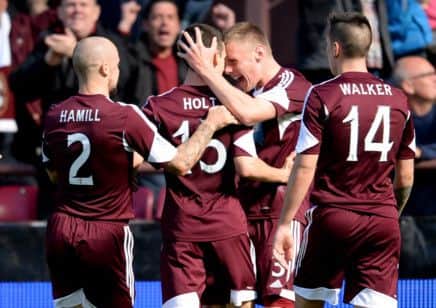 Jamie Holt celebrates his goal against Celtic with his team-mates - but the Tynecastle club's fate lies with others. Picture: SNS