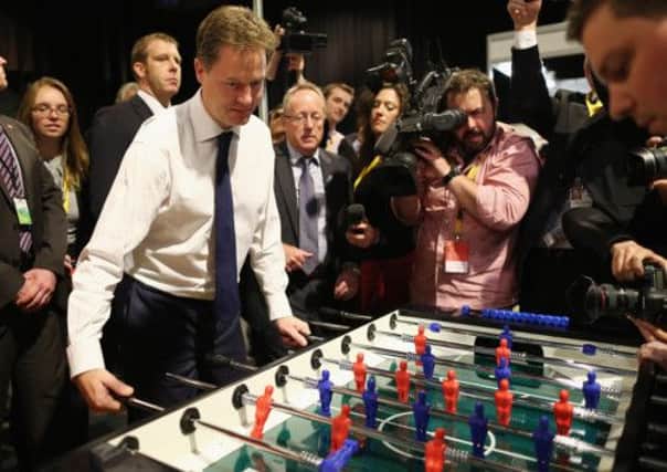 Lib Dem leader and deputy prime minister Nick Clegg plays a spot of table football - for the blue team. Picture: Getty