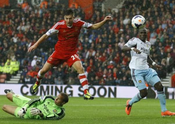 Jussi Jaaskelainen frustrated Southampton; here he foils Adam Lallana. Picture: AP
