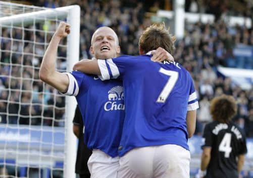 Steven Naismith celebrates his goal against Chelsea with former Ibrox team-mate Nikica Jelavic. Picture: PA