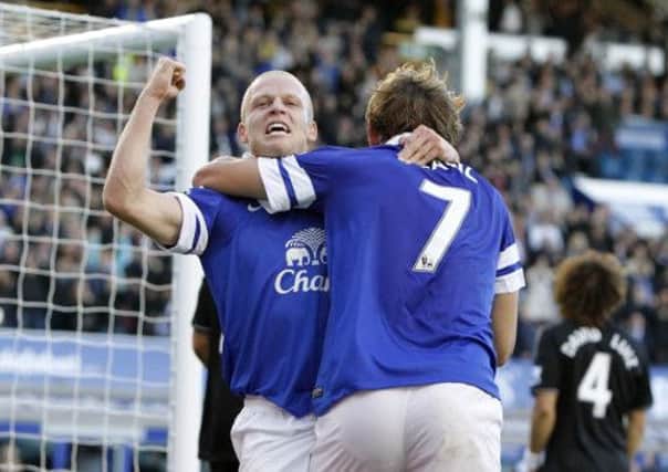 Steven Naismith celebrates his goal against Chelsea with former Ibrox team-mate Nikica Jelavic. Picture: PA